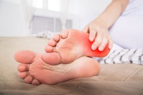 What is the symptom of foot pain